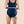 Model shows back view of Hem Support wear's prolapse support underwear